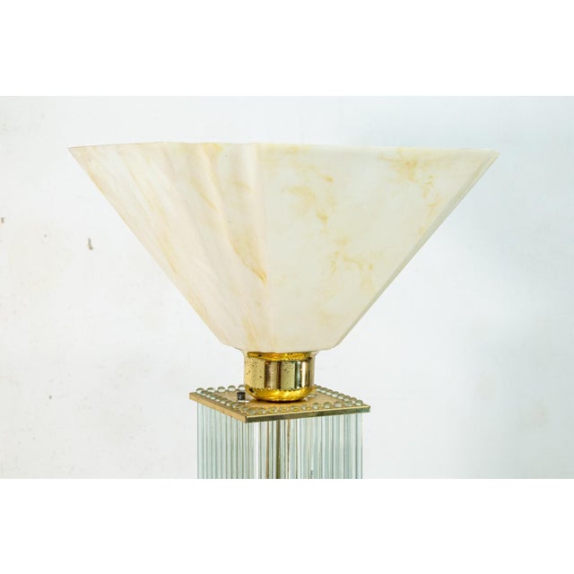A 1960s Gaetano Sciolari brass and glass cane floor lamp. This extraordinary floor lamp features a breathtaking design and...