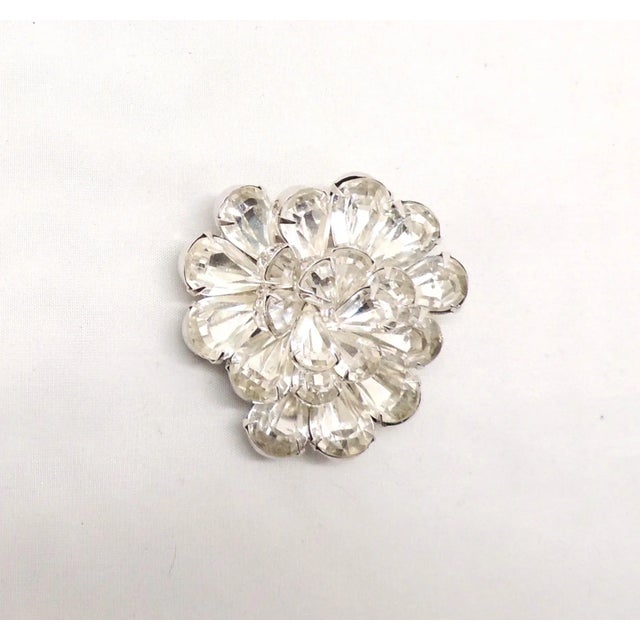 This is part of Chairish’s Costume Jewelry assortment. 1960s rhodium plated prong set tear drop shaped clear rhinestone...