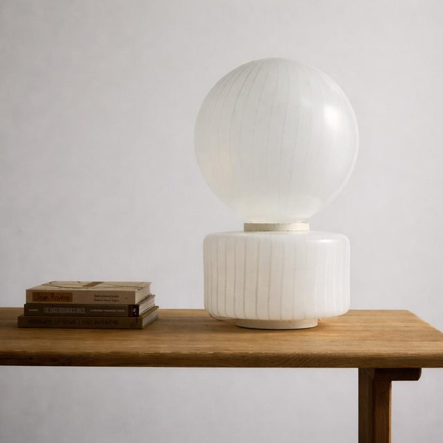 This monumental two-piece Murano glass table lamp by Vistosi, circa 1950s, showcases a hand-blown striped shade paired...
