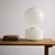 This monumental two-piece Murano glass table lamp by Vistosi, circa 1950s, showcases a hand-blown striped shade paired...