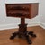 This restored American Empire work or side table features a flame/crotch mahogany top, with two rounded, dovetailed...