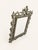 An exceptionally decorative antique tabletop mirror featuring an elaborate Rococo Revival frame, richly cast with...