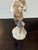 Design Plus Gallery presents the Porcelain Figurine Man with Geese by Miquel Requena for Lladró. The man in the figurine...