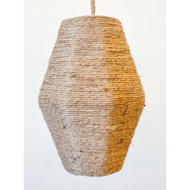 Custom small Cocoon light fixture hand crafted. Its made of 3-4ply Jute. The size is 16” x 19”