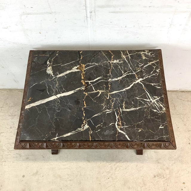 Rich in old-world character, this vintage table captures the grandeur of Renaissance design. Its rectangular marble top...