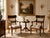 Elegant pair of vintage Neoclassical armchairs in the style of Georges Jacob, featuring beautifully carved wood frames...