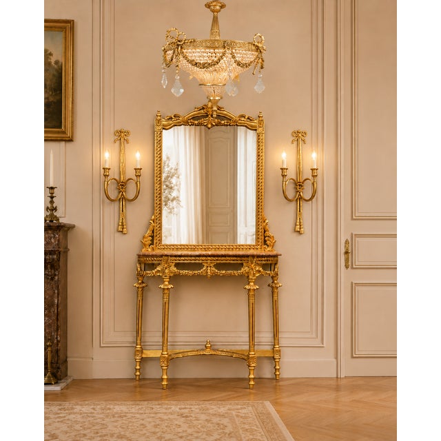 A refined 1950 French Louis XVI-style console and mirror set, beautifully crafted from hand-carved beech wood with a...