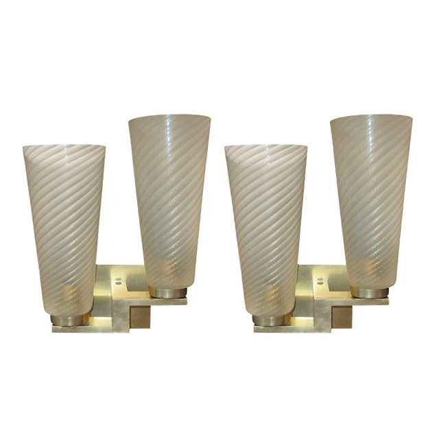 An elegant and refined set of four limited-edition Italian wall sconces, crafted in the 1990s and executed with...