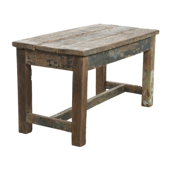 Patinated wooden table. XXth century table in old patinated teak. This table is made up of a large wooden tray worn out by...