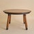 A French dining table from the 1960s, crafted in the manner of Georges Robert. The round solid wood top is constructed...