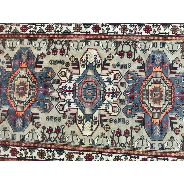 Mid-20th century Caucasian rug with a Shirwan design, and light colors, wool velvet on cotton foundations.