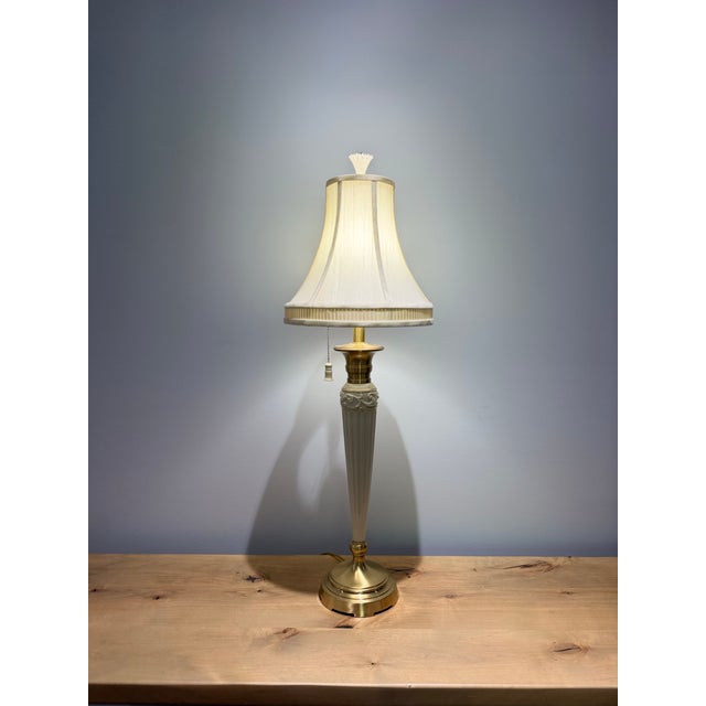 A refined and elegant Lenox for Quoizel table lamp showcasing the timeless sophistication of neoclassical design. Crafted...
