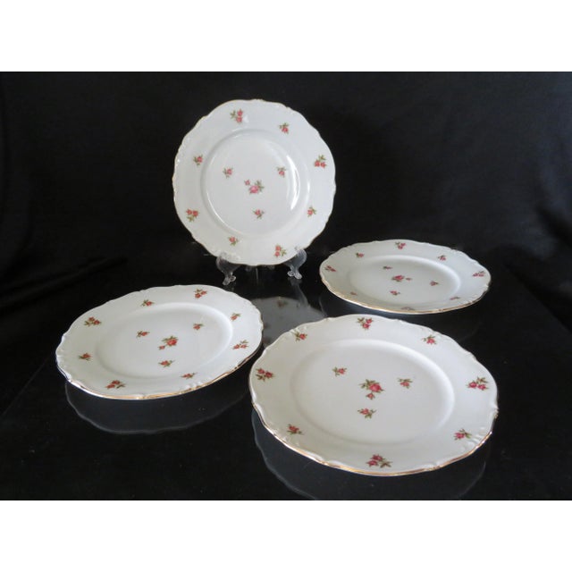 This is a beautiful set of vintage tableware. It is a set of 7.5" dessert or bread plates with a scattered rose pattern...