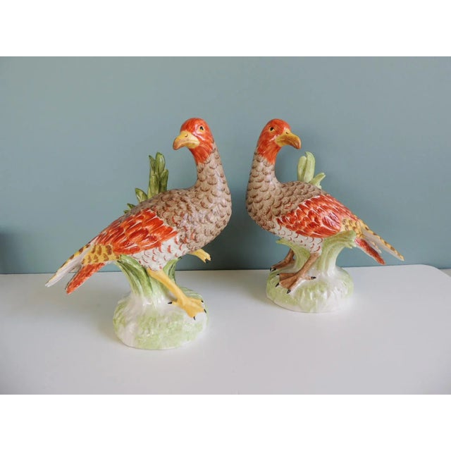Orange and Green Chelsea House Inc Ceramic Birds - Set of 2 Hand painted Size: 5.5”D x 9.5”W x 10.5”H