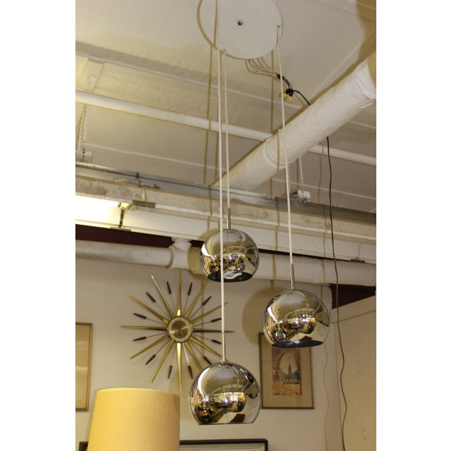 This beautiful piece of illuminating art comes to you from the 1970’s. The chrome balls of this hanging light are in great...
