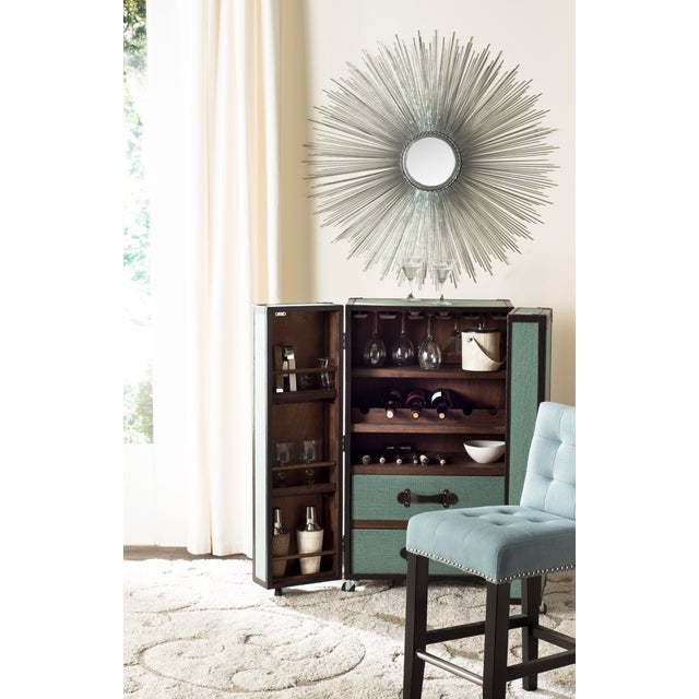 The Sunburst Mirror with it's delicate wire spokes radiating from a central disc will glow night and day to reflect your...