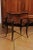 A French Louis XV style marquetry dressing table from the 19th century, with floral motifs and cabriole legs. Born in...