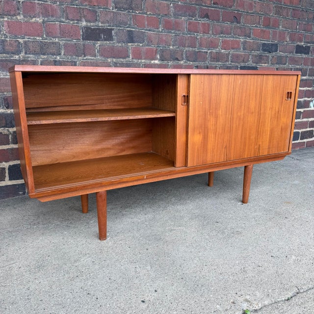Beautiful mid century teak credenza. Maker unknown.