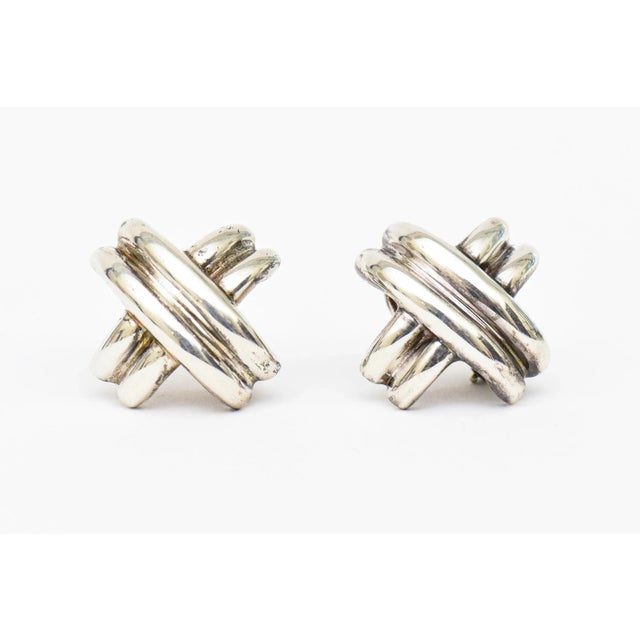 This is part of Chairish’s Costume Jewelry assortment. These classic Tiffany and Co hallmarked sterling silver pierced...
