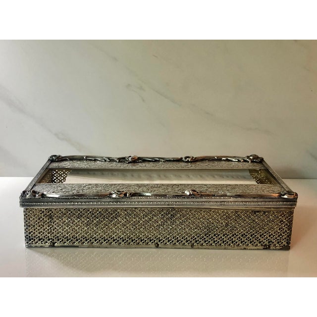 This stunning 1940s Silverplate Repoussé Tissue Box Cover is ready for display in a truly sophisticated home. The...