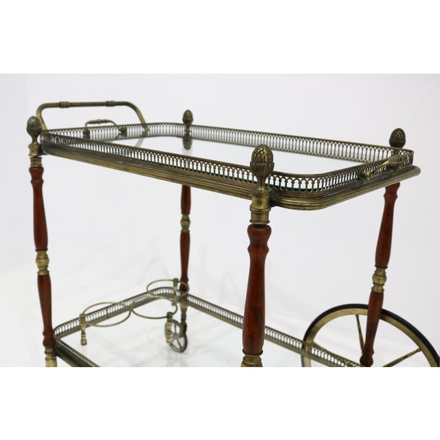 Rare neoclassical bar cart by Maison Baguès, France, 1940s. This Hollywood Regency piece features a refined brass frame...