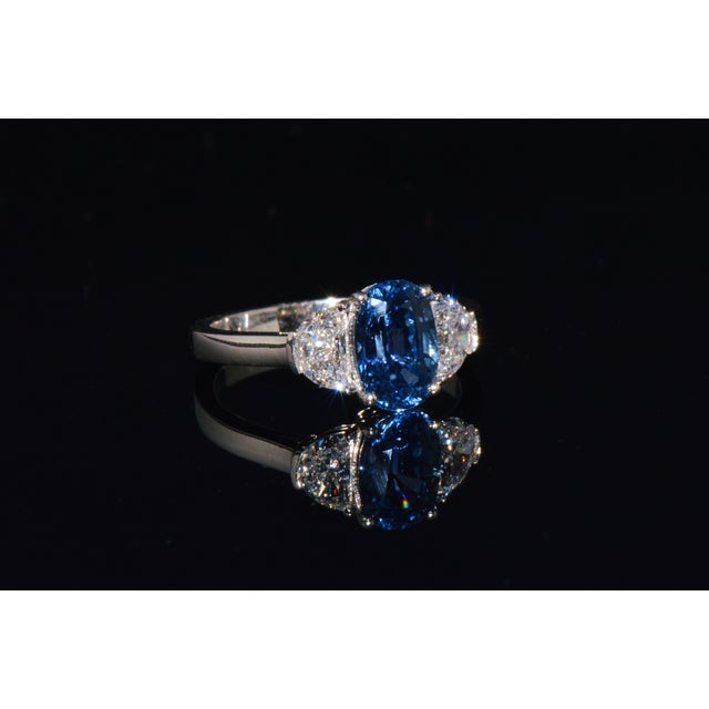 GIA certified 2.66CTS diamond and sapphire three stone solid 950 platinum ring. This ring features a stunning GIA...