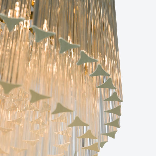 Layer upon layer of mid-century inspired pink or amber triedri style glass prisms make our Amaro chandeliers the perfect...