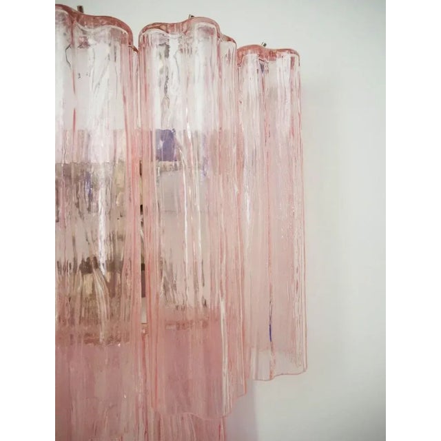 Italian vintage pair of wall sconces in Murano glass and nickel-plated metal structure. The armor polished nickel supports...