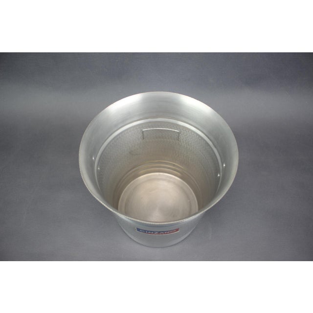 Vintage Cinzano ice bucket produced in Italy during the 1970s, featuring an elegant minimalist form with textured aluminum...