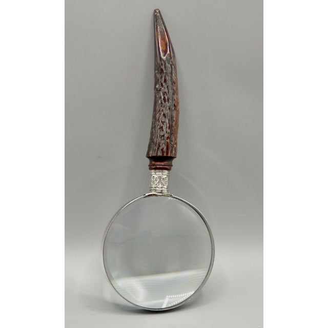 A fine quality antique English natural stag horn handled magnifying glass with sterling silver mounts. Maker is Henry...