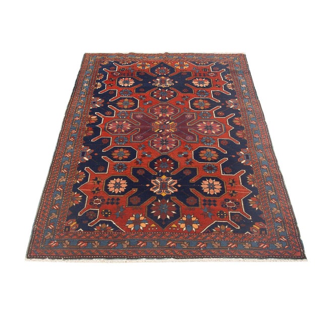 Antique decorative wool handknotted Caucasian rug. Approximately 75-85 years old. In very good condition.