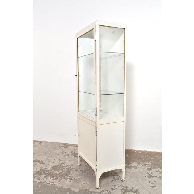 Beautiful medicine cabinet. The two glass plates in the upper part can be adjusted in height. In the lower (closed) part,...