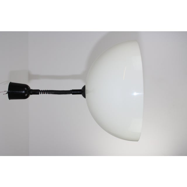 1 socket E27, drawbar infinitely adjustable, height 70 to 130 cm, shade made of white plastic This piece is attributed to...