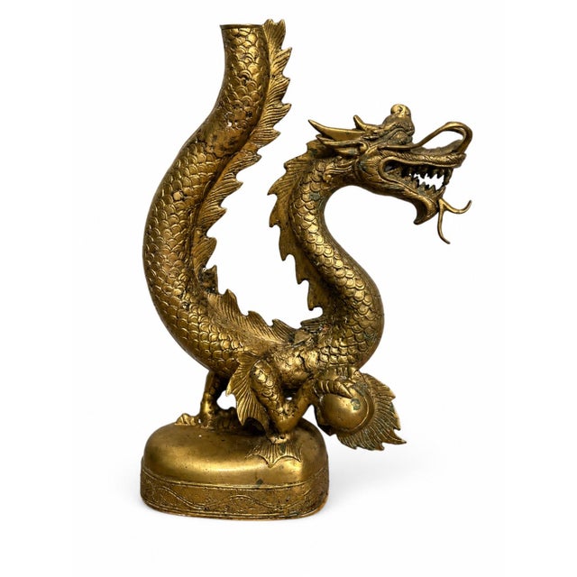 A spectacular monumental vintage candelabra featuring a sinuous Chinese dragon rendered in richly detailed cast brass....