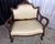 A captivating testament to old-world romance, this petite Victorian-era mahogany settee pairs dramatic grandeur with a...