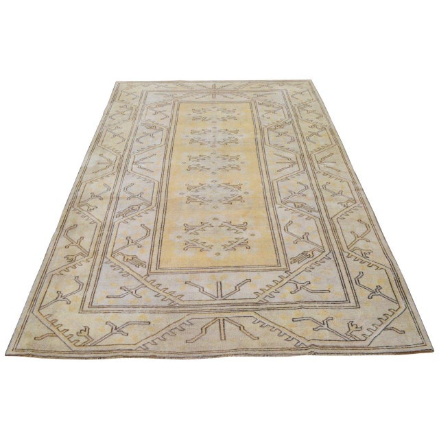 Hand-knotted with care using traditional rug-making techniques, this wool rug blends timeless craftsmanship with a modern...