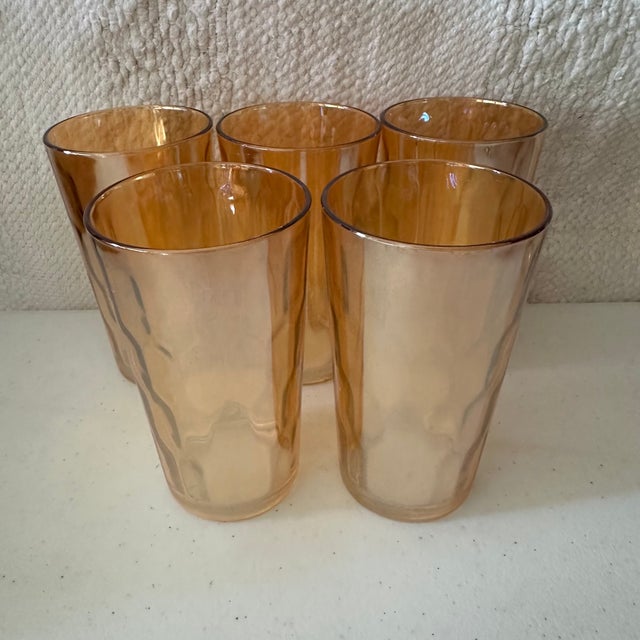 A set of 5 vintage tall tumblers. Beautiful peach luster color to the slightly textured glass. Perfect for using as water...
