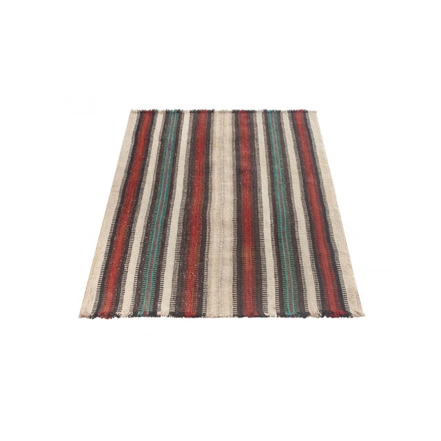 Vintage handwoven decorative kilim rug from Kars region of Turkey. Approximately 50-60 years old. In very good condition.