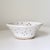 Handmade studio pottery berry bowl or ceramic colander featuring a softly irregular organic form and hand-pierced drainage...