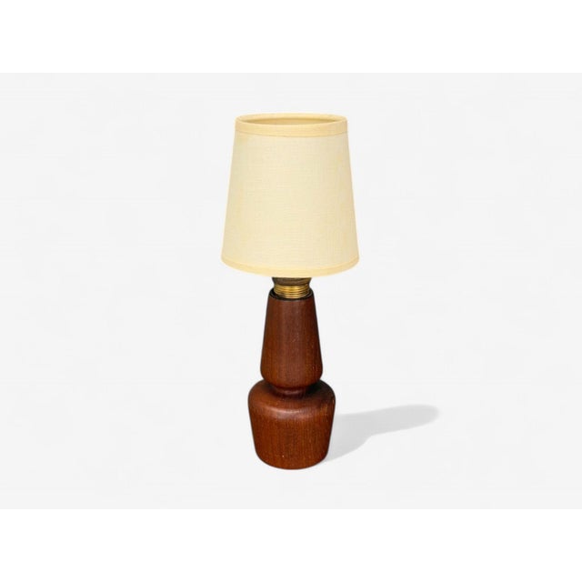 Mid-Century Modern, Teak, Small Table Lamp, Sweden, 1940s A diminutive carved teak and brass table lamp designed and...