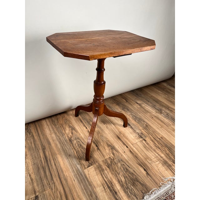 This antique candle stand dates to the 19th century and reflects the enduring influence of the Hepplewhite tradition, seen...