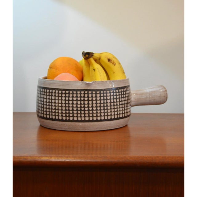 Elegant and graphic, this ceramic piece by Émile Masson is an example of French mid-century design. Made of glazed...