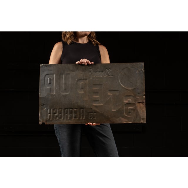 c. 1940s-1950s; Step Up Beverages - U.S.A. Embossed tin advertising sign for Step Up soda, bearing the slogan "Drink Step...