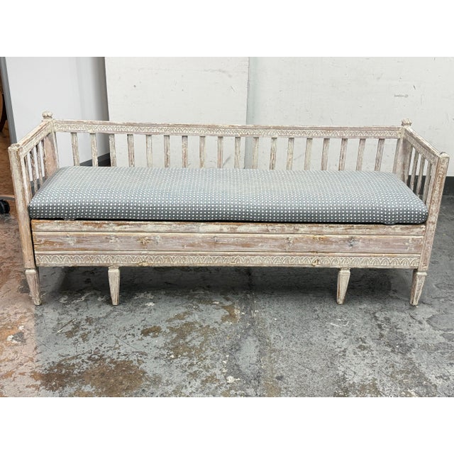 Design Plus Gallery presents a Swedish Antique Bench + Upholstered Seat Cushion. The long rectangular frame is detailed...