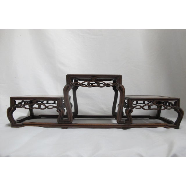 Antique Chinese marble-inset carved rosewood stand with three stepped tiers. Measures 22" x 7 1/4" x 7" Excellent...