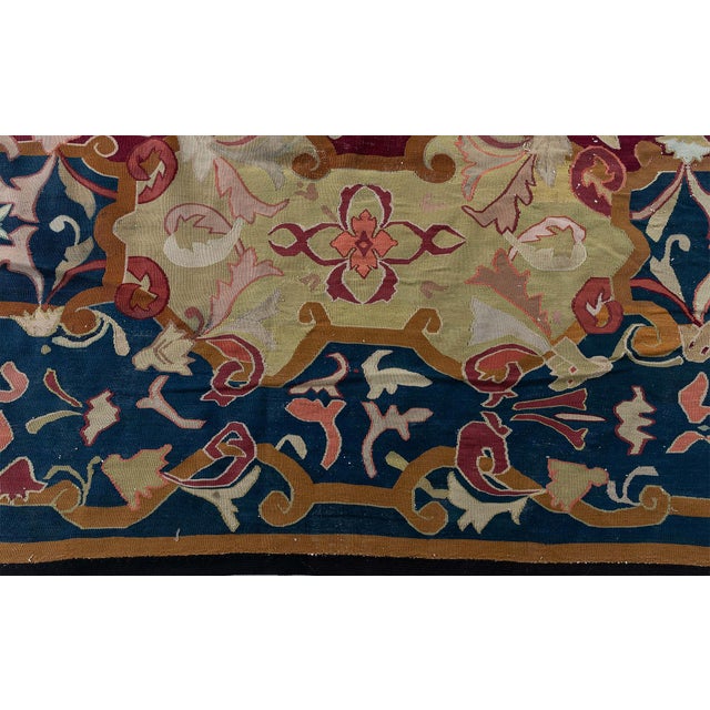 This striking French Aubusson carpet, woven circa 1860, is a tour de force of the Baroque Revival style, showcasing the...