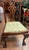A handsome set of six Chippendale-style side chairs with richly carved, pierced splat backs and shaped crest rails. The...