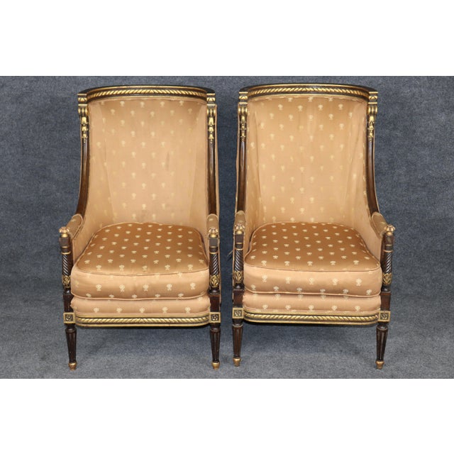 An exceptional and increasingly scarce pair of French Directoire bergère lounge chairs, these elegant seats embody the...