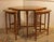 Circa 1970s Mid Century Modern coffee table & nesting tables set, English. Oak. Octagonal coffee table with 4 modified...