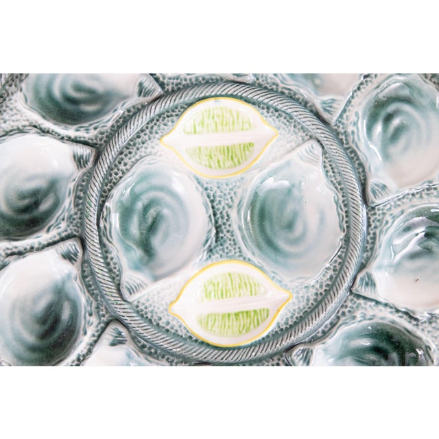 A lovely large antique French majolica oyster platter made at the St. Clement faience factory in France, circa 1920-1930....
